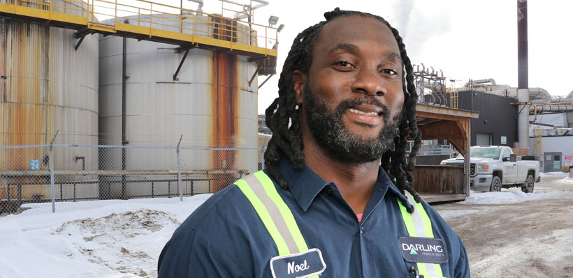 UFCW 1006A member Noel smiles for a photo in the parking lot of the Darling International plant where he works.